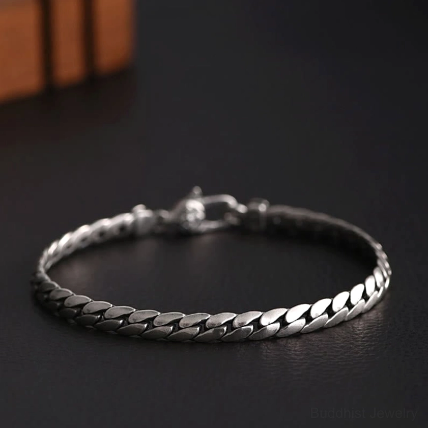 Double dorje vajra copper bracelet top view displaying intricate chain texture