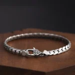 Double dorje vajra copper bracelet showing premium buckle clasp and flat chain links