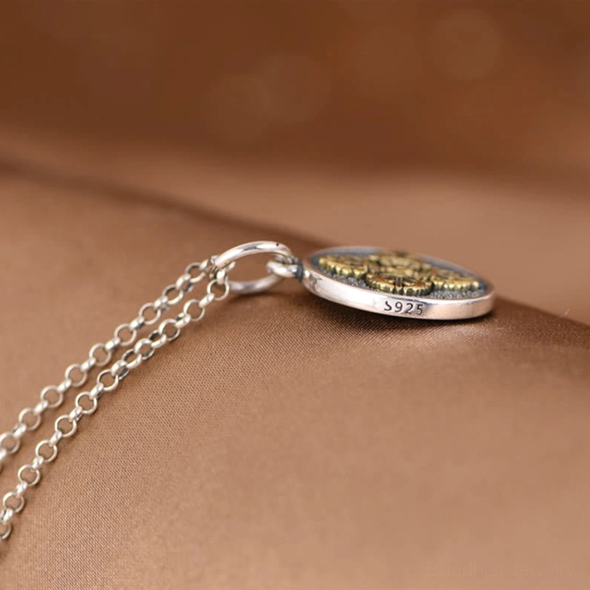 Flat lay view of sterling silver double dorje vajra pendant with S925 hallmark