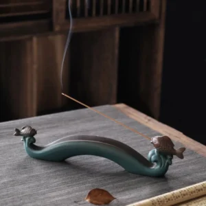 Double Koi Fish ceramic incense burner with smoking incense stick on tea table
