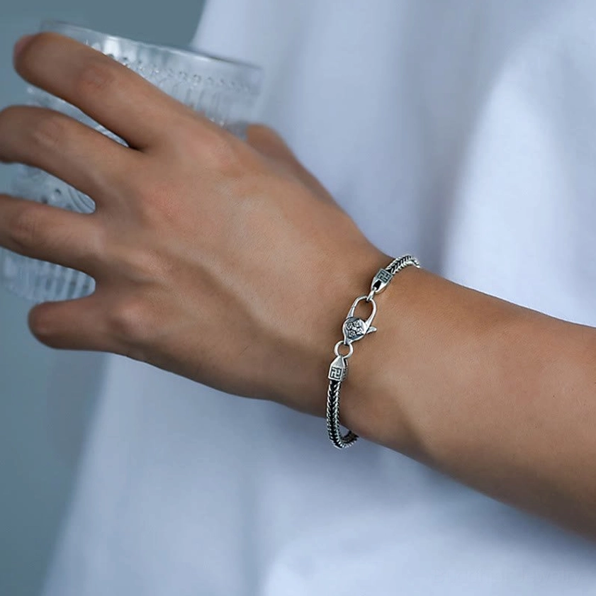Buddhist protection bracelet worn on wrist showing comfortable fit and vintage copper finish in daily wear