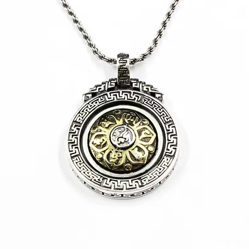 Double vajra Buddhist pendant front view featuring two-tone gold and silver finish with lotus flower center