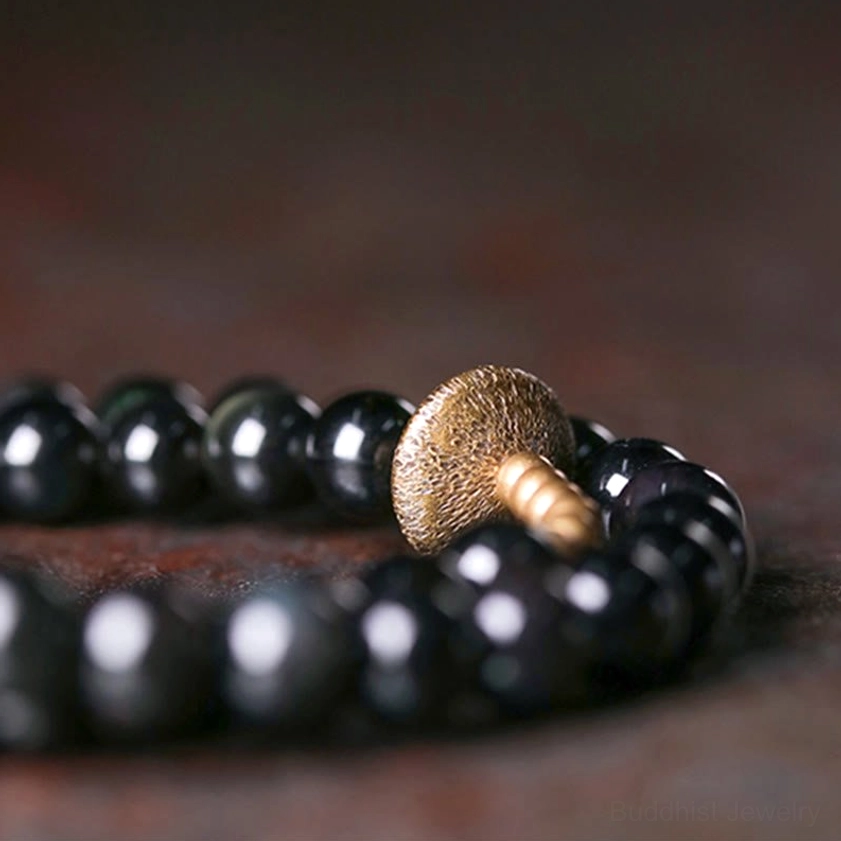 Full laid-out double wrap bracelet top-down view displaying complete design with multiple hammered copper decorative pieces and glossy black obsidian beads