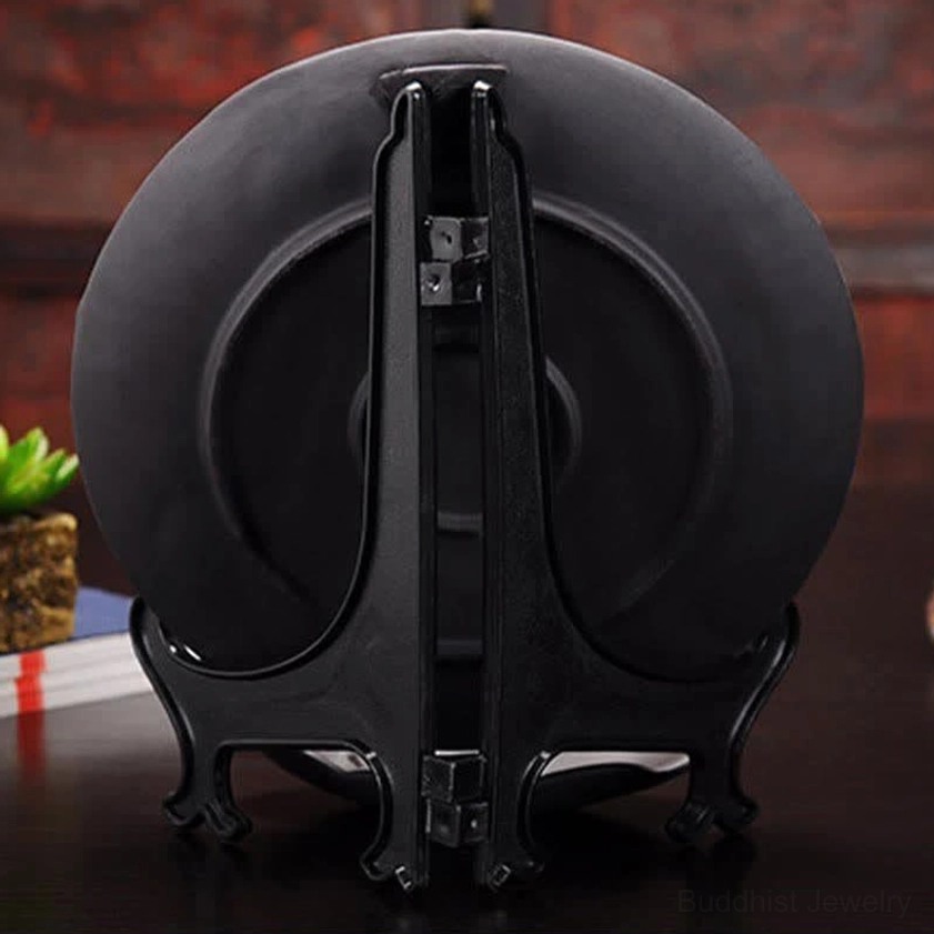 Rear view of dark grey ceramic incense burner showing back profile and display stand