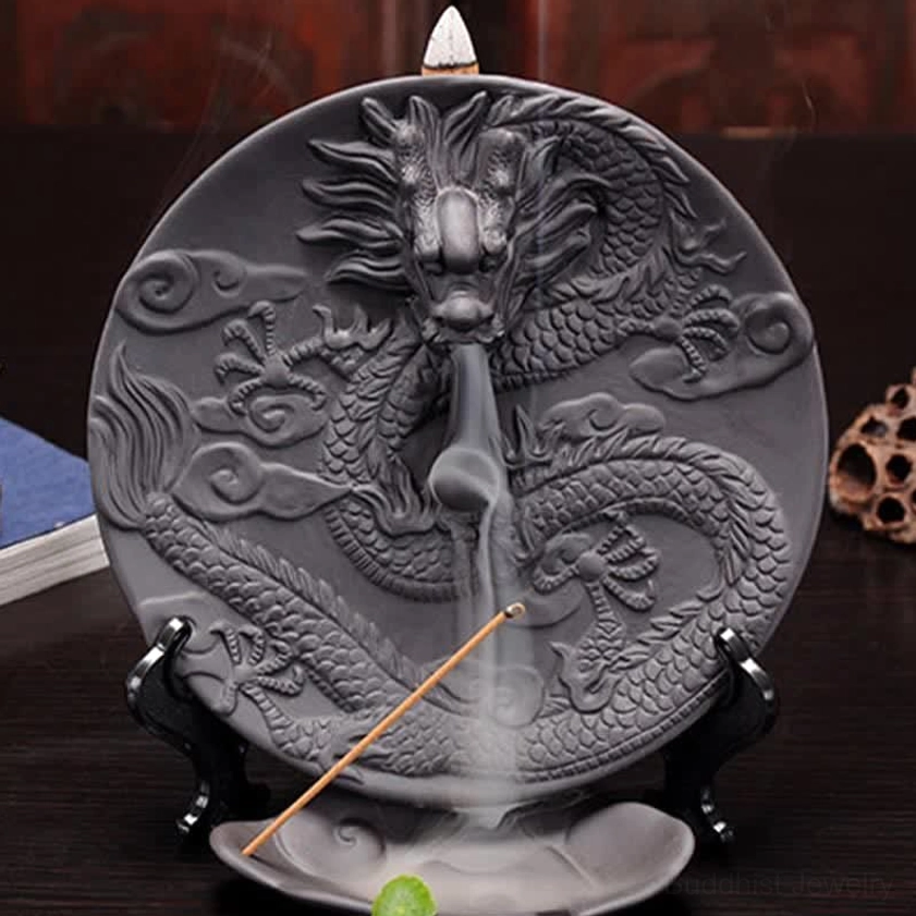 Full front view of dark grey ceramic dragon incense burner with green stone and flowing smoke