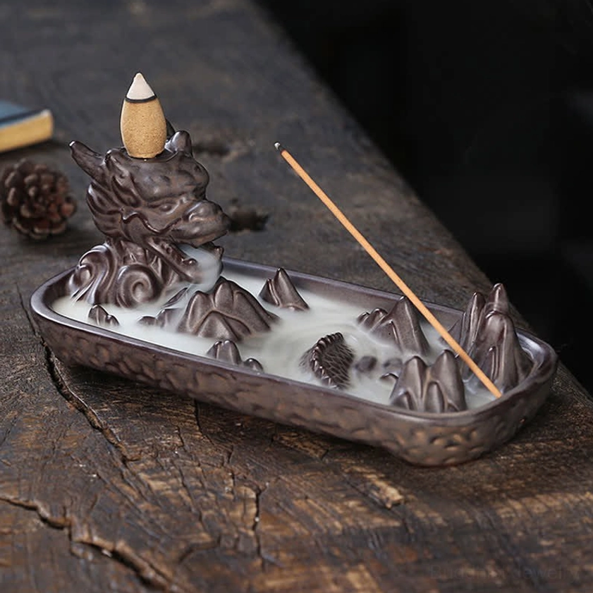 Right front three-quarter view of handcrafted dragon ceramic incense burner with dark matte finish and mountain landscape design