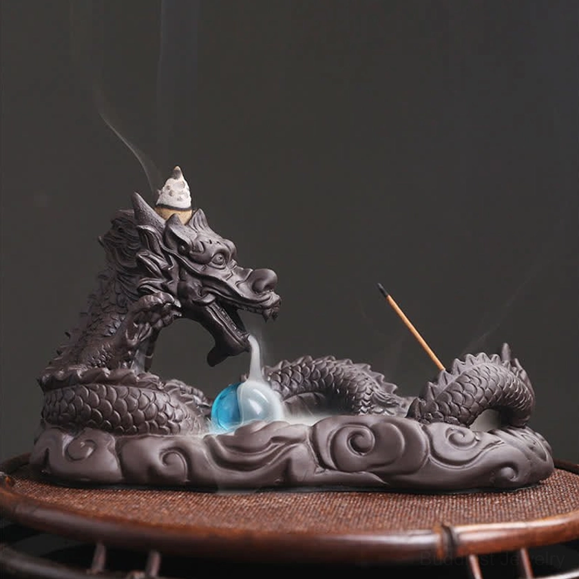 Dragon incense burner right side view with faint smoke cascade, purple clay construction and traditional design on bamboo display base