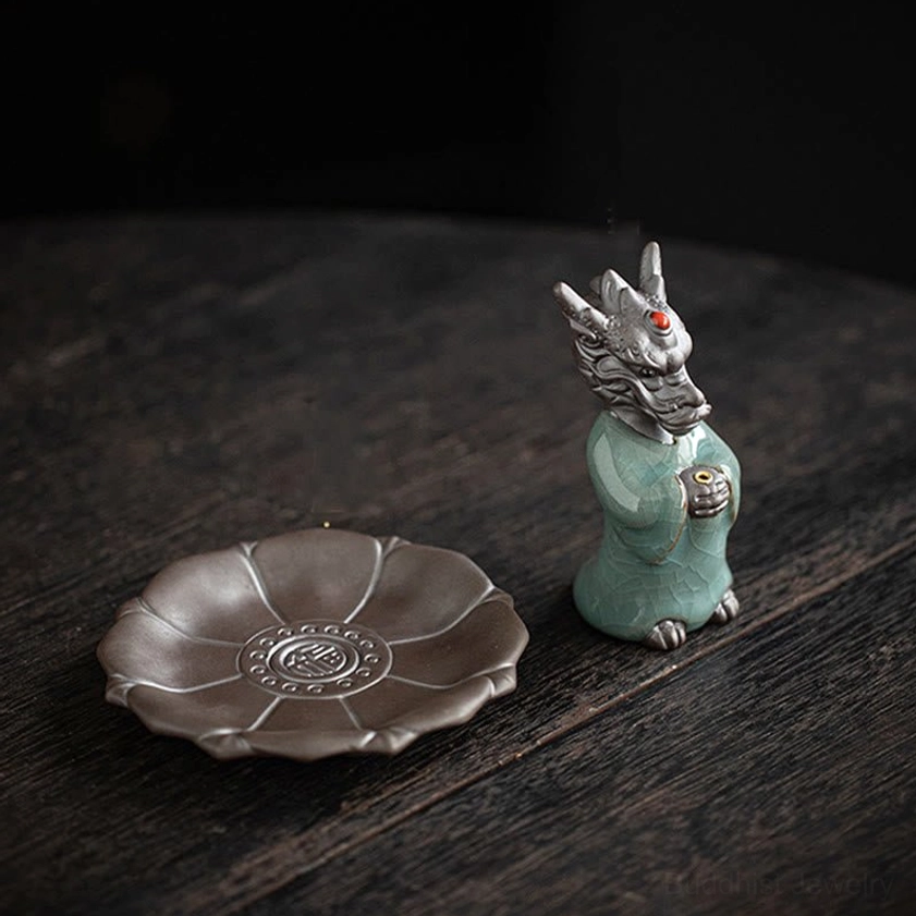 Complete dragon incense burner set with lotus tray from above, showing carved Fu character pattern and standalone celadon dragon figurine