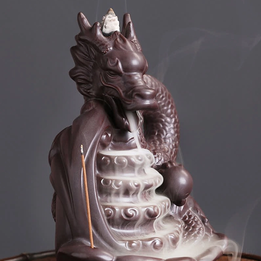 Dragon ceramic incense burner rear three-quarter perspective with rising incense smoke from base and wave pattern details