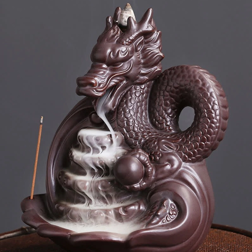 Dragon backflow incense burner showing layered incense waterfall effect and cascading smoke flow from left front angle