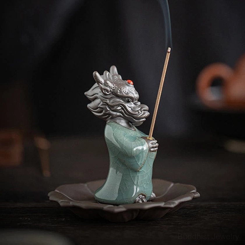 Dragon king incense holder set displayed on tea table, left side view showing smoking incense and lotus-shaped ceramic tray