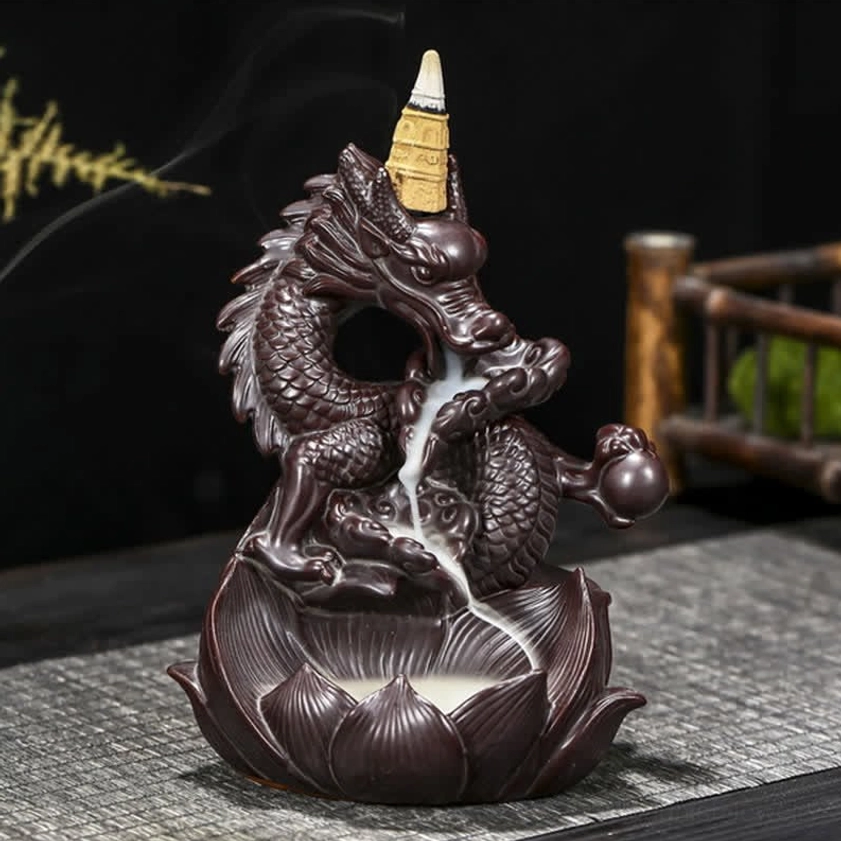 Backflow incense burner with mesmerizing cascading smoke effect, dragon and lotus design, front three-quarter view with lotus-shaped base on woven mat