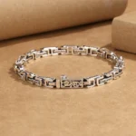 Dragon Om Mani Padme Hum copper bracelet flat lay showing engraved chain links with dragon motif