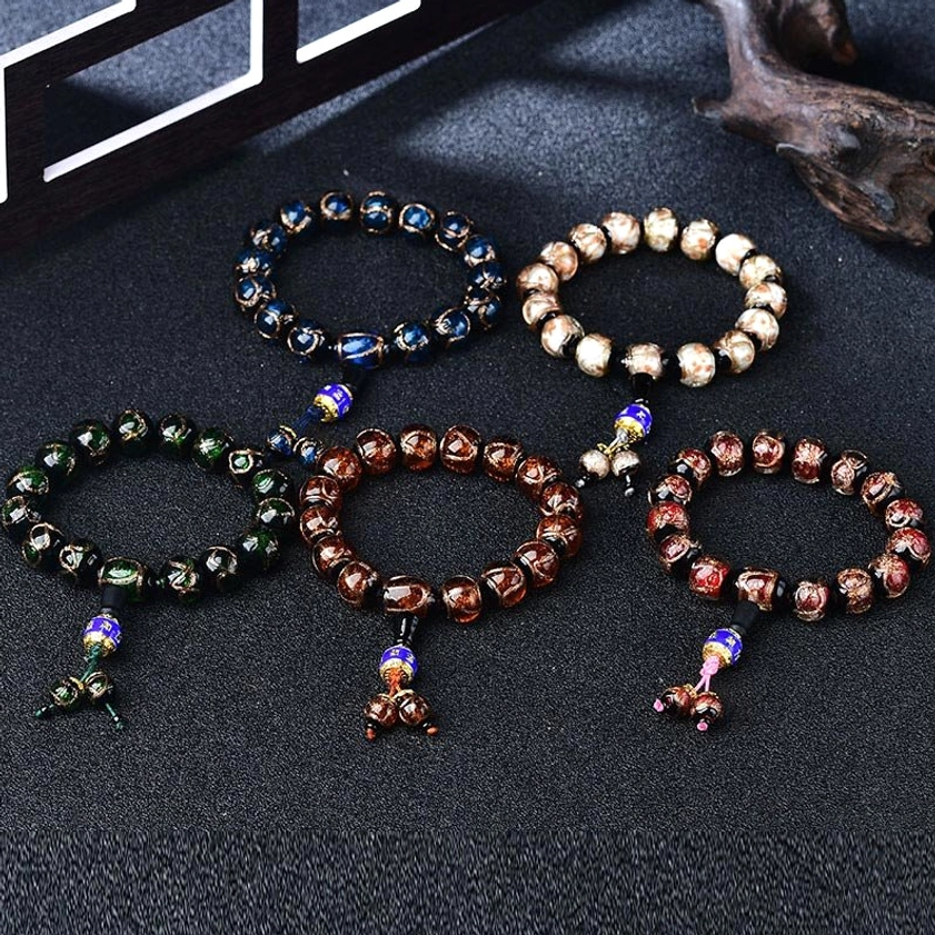 Multiple dragon vein agate beaded bracelets in various colors showing color variants