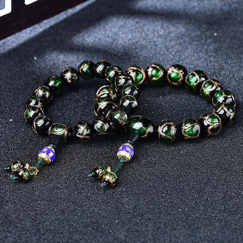 Two dark green dragon vein agate bracelets displayed together showing texture