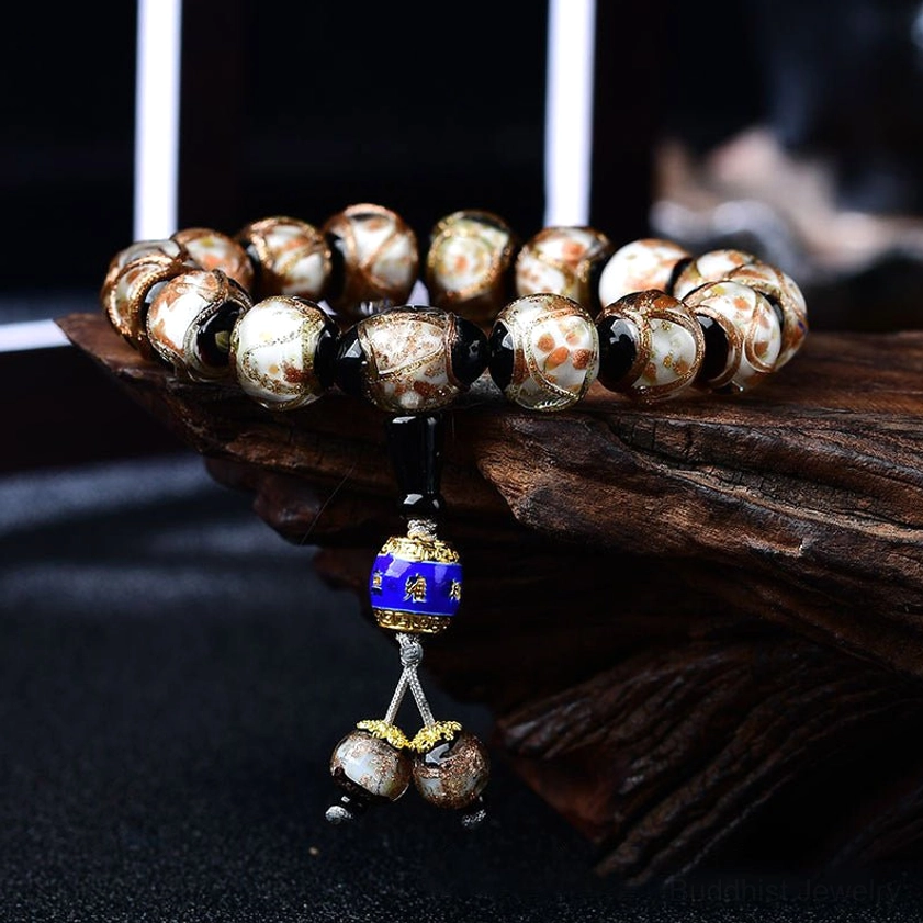 Dragon vein agate bracelet detail shot showing golden flecks and agate striped patterns