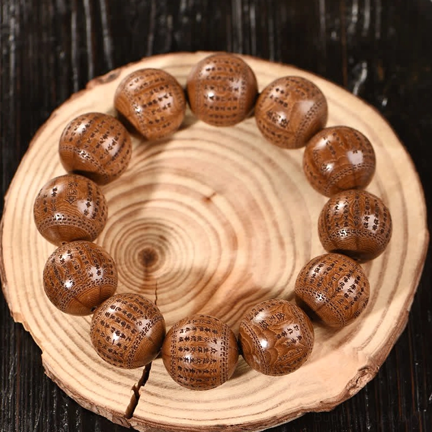 Authentic Dragon Wood prayer bracelet with elastic band featuring deep spiritual engravings