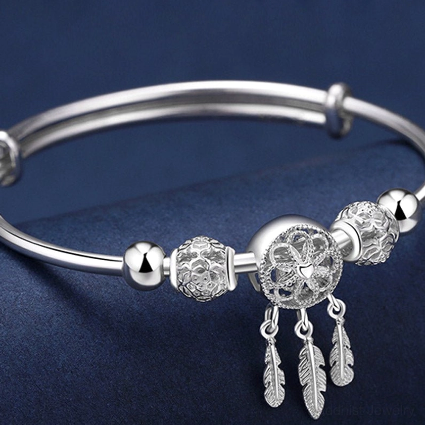 Gift packaging presentation of handcrafted silver dream catcher buddhist blessing bracelet ideal for spiritual occasions and meaningful gifting
