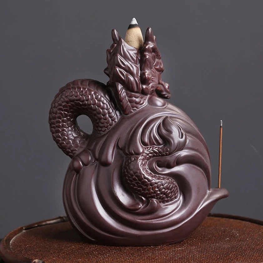 Dual-dragon ceramic backflow incense burner with wave pattern ceramic base and dark brown matte finish, rear perspective