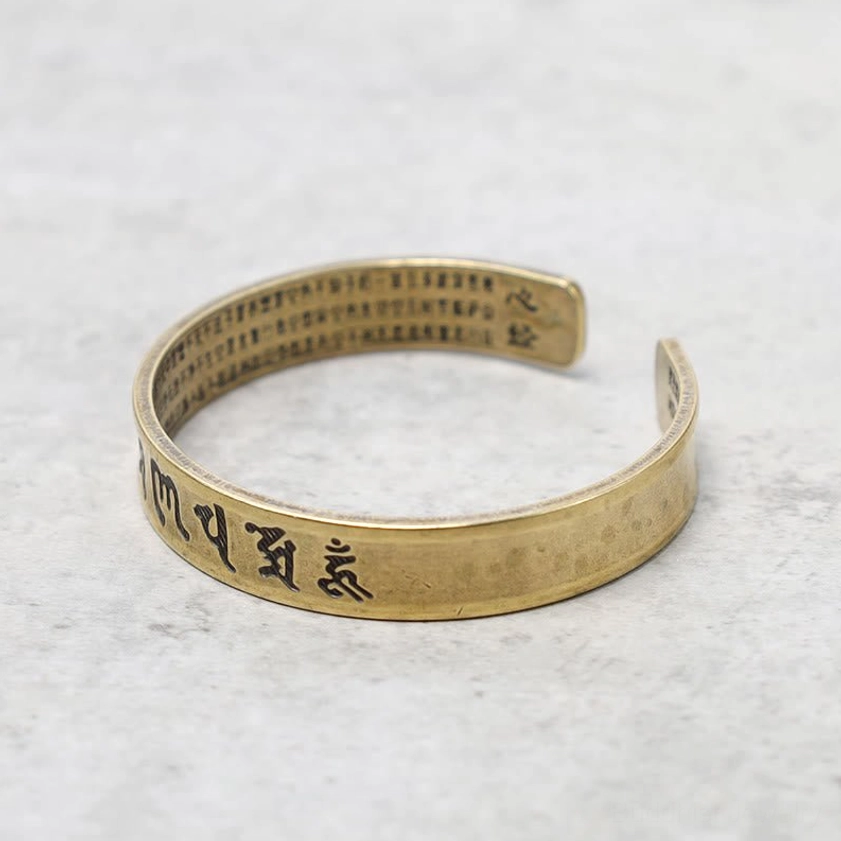Double-sided engraved Buddhist bracelet featuring Sanskrit mantra on outer surface and Chinese sutra on inner band