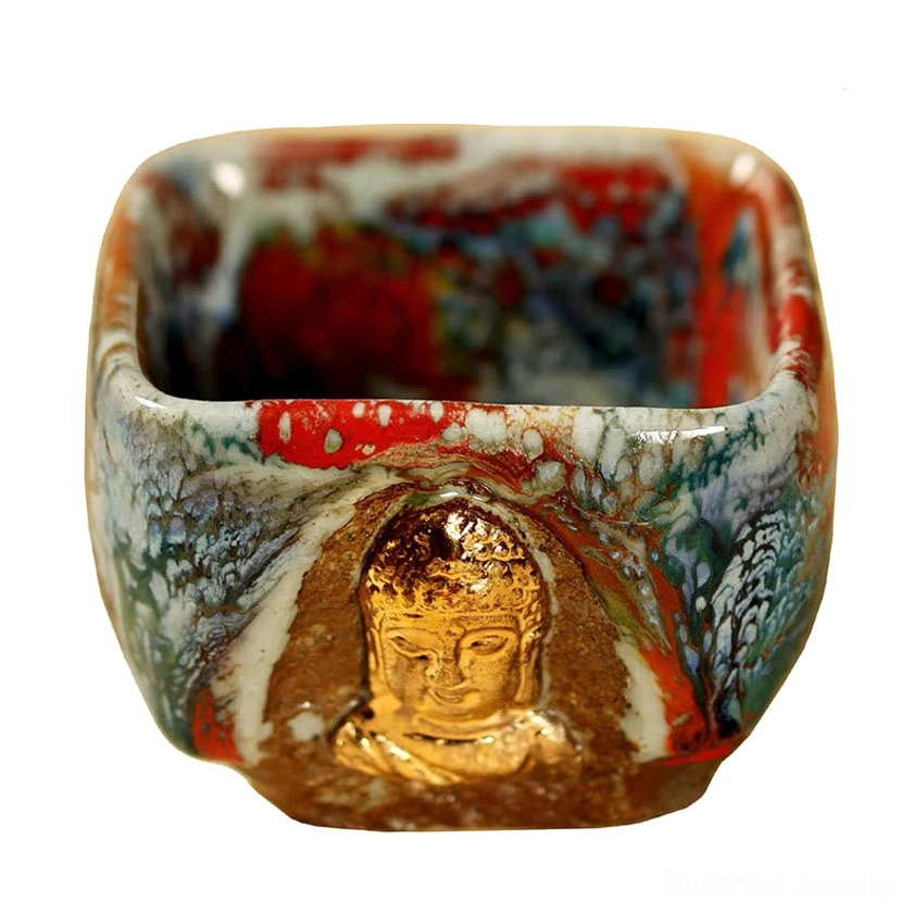 Dunhuang meditating Buddha Shino teacup showcasing handmade craftsmanship with organic glaze variation and gilded Buddhist iconography detail