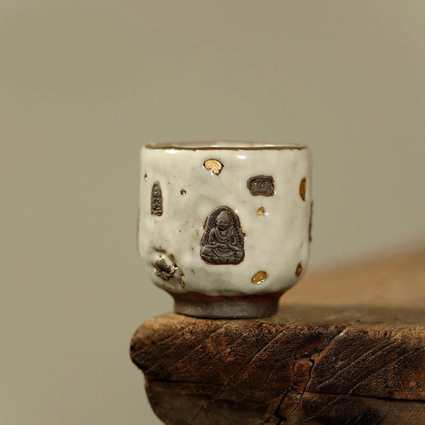 Hand-painted Dunhuang Buddhist round Shino ceramic teacup with carved grotto designs, crackle glaze, and golden accents perfect for mindfulness tea ceremonies