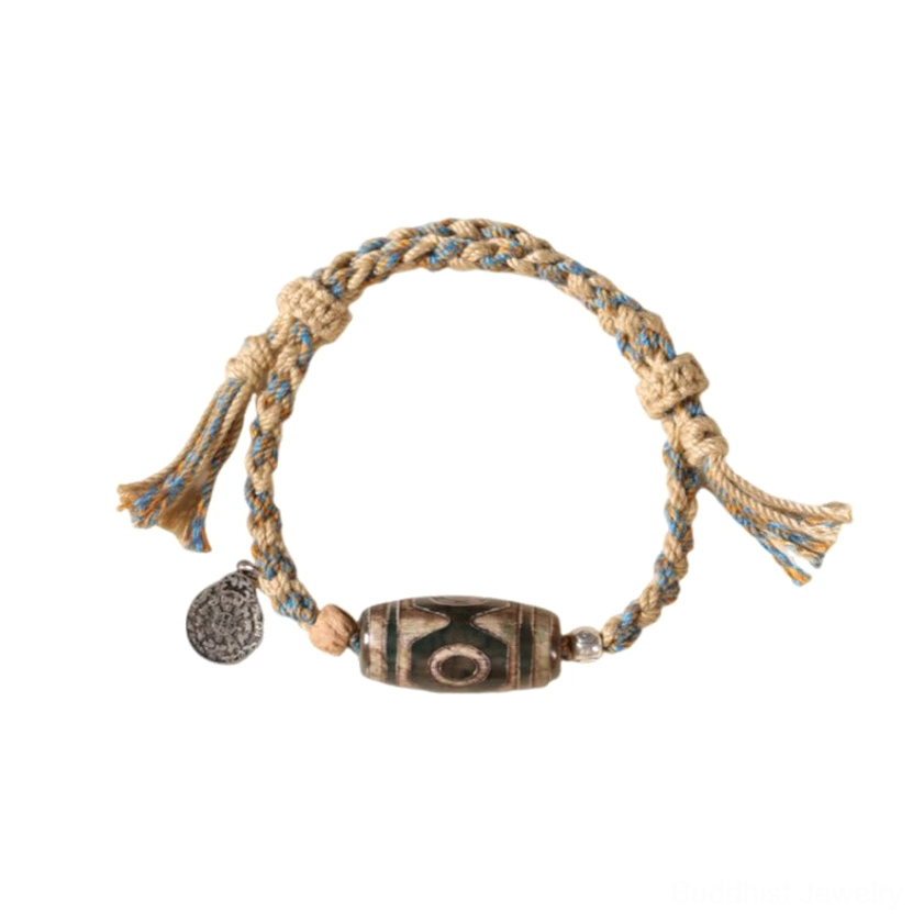 Dzi bead wealth protection bracelet lifestyle shot displaying Buddhist jewelry for prosperity and spiritual harmony
