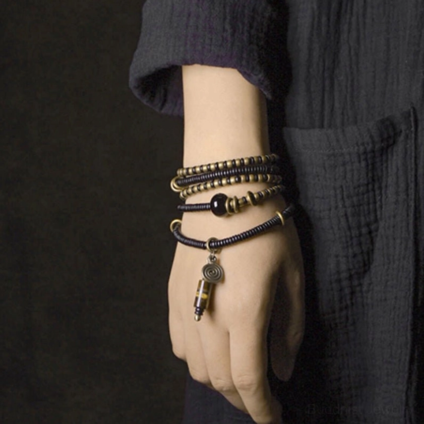 Triple-layer ebony wood dzi bead copper bracelet necklace stacked front hand view showing complete jewelry design