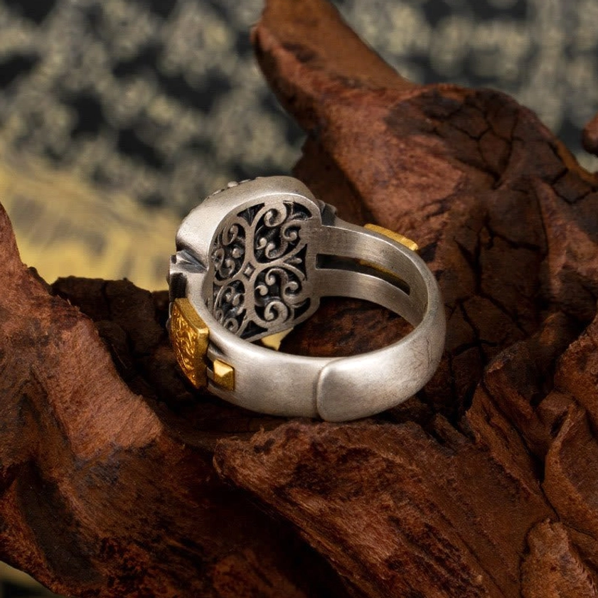 Wealth and protection Dzi bead ring back view, showcasing hollowed floral pattern on 925 sterling silver band and intricate ring design