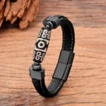 Nine-Eye Dzi Bead leather bracelet with geometric carved pattern and black magnetic metal clasp, front three-quarter view