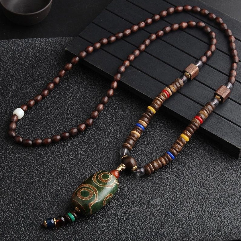 Hand-painted Dzi bead Buddhist meditation necklace with green patterned sacred bead and wenge wood beads on wooden display stand