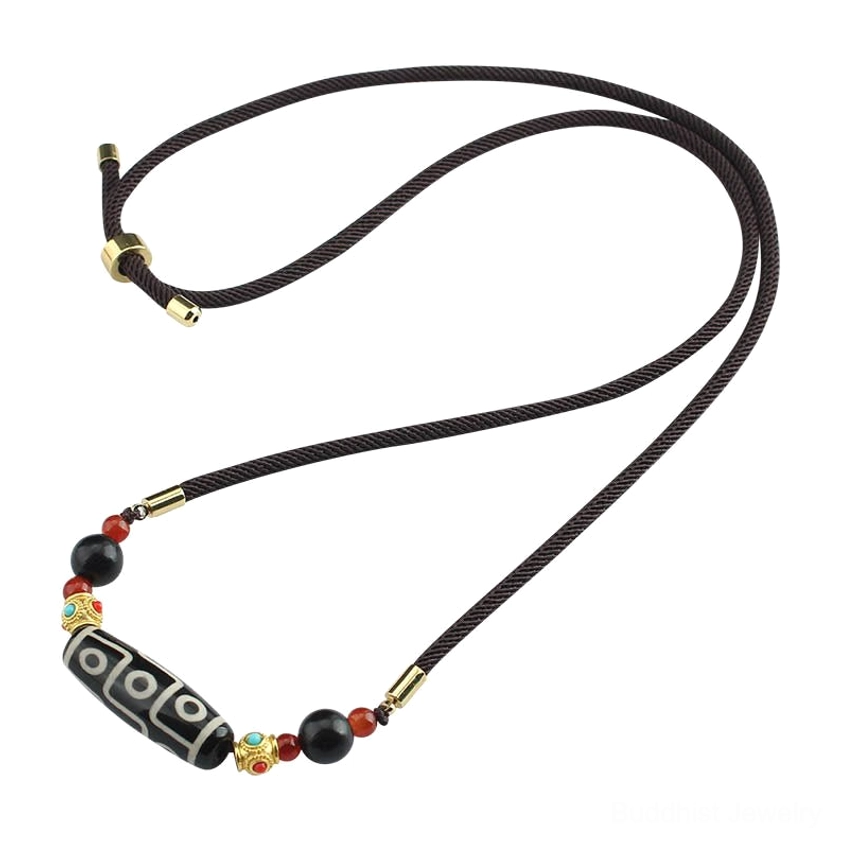 Nine-Eye Dzi Buddhist protection necklace with natural stone and rope construction detail and spiritual significance