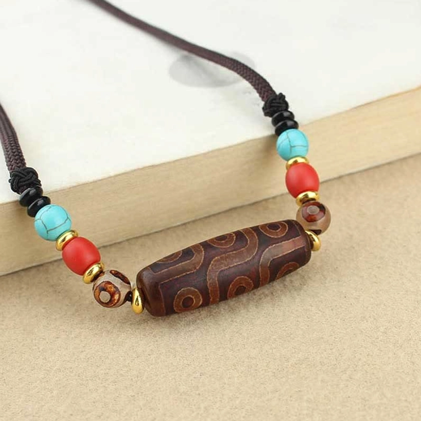 Dzi bead Buddhist necklace worn styling showing how to wear protection pendant close to heart for spiritual connection