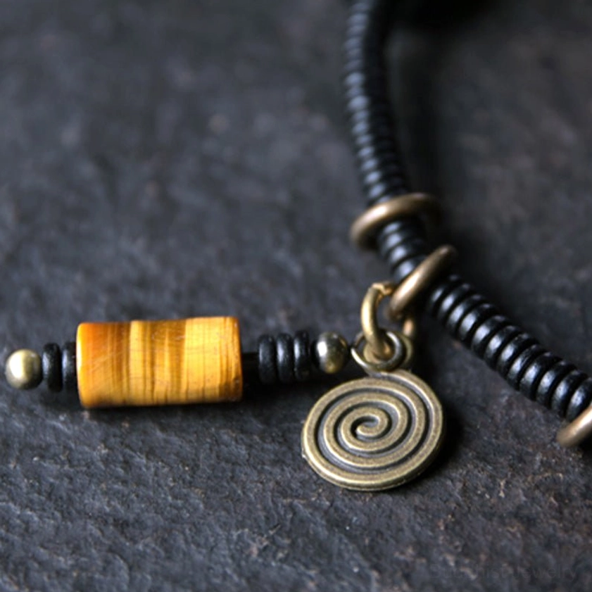 Ebony wood dzi bead copper peace bracelet necklace unboxing product packaging showing handmade spiritual jewelry gift set