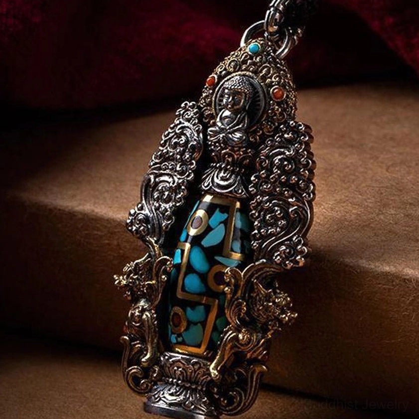 Tibetan-inspired dzi buddha pendant with seated buddha figurine, colored gemstone accents, and detailed filigree metalwork for spiritual energy