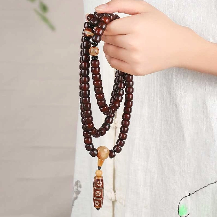 Buddhist dzi mala bracelet with three-eye and nine-eye stones, jade beads, bodhi seeds showing complete spiritual jewelry set for meditation