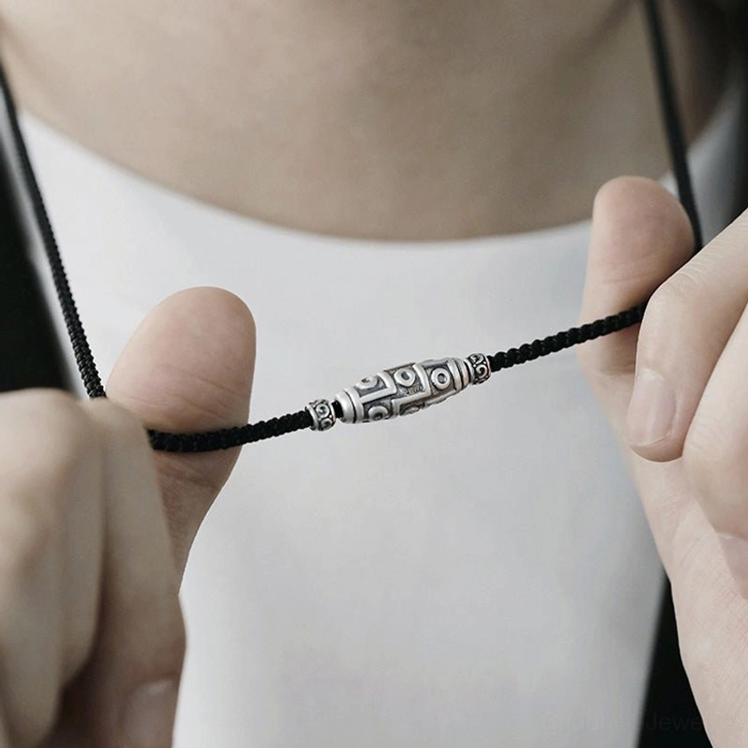 Buddhist dzi necklace worn styling guide showing how to adjust rope length for comfortable daily wear and spiritual practice
