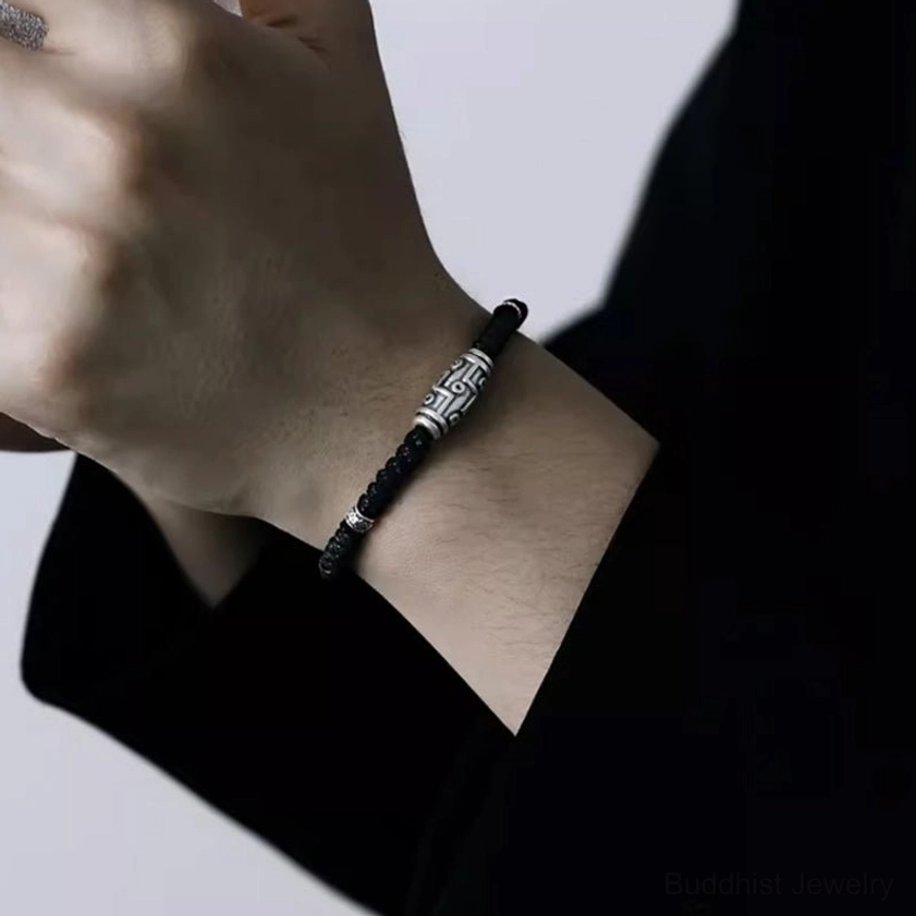 Multiple nine-eye dzi silver bracelets displayed together showing size consistency and handcrafted quality variations