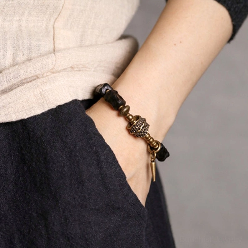 Ebony wood copper couple bracelet side view highlighting natural grain texture and bronze hardware craftsmanship