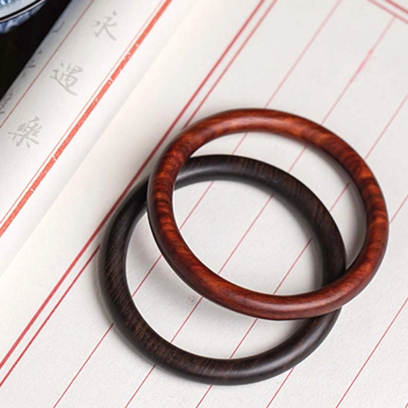 Ebony Buddhist Wood Bangle - showing dark polished finish and natural wood characteristics