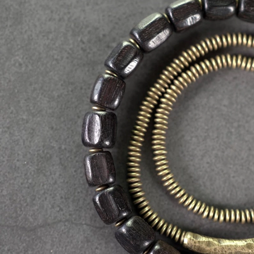 Layered view showing ebony wood and ridged copper coil beads mixed together