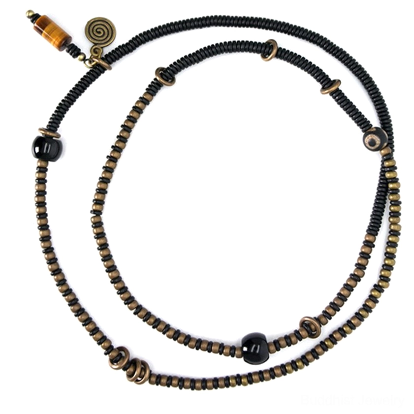 Ebony wood dzi bead peace bracelet necklace lifestyle shot showing daily wear spiritual practice meditation accessories