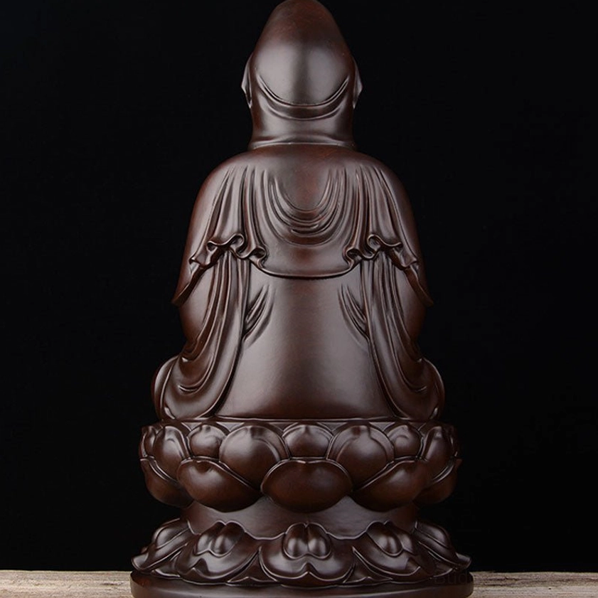 Ebony Avalokitesvara back view showing layered robe folds and solid lotus pedestal base