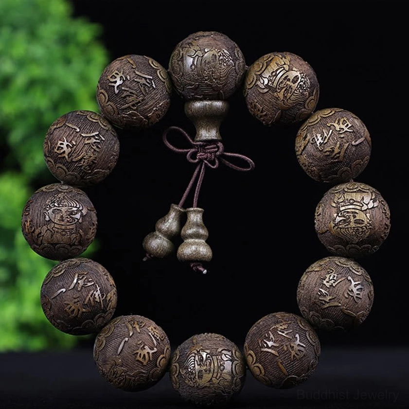 Ebony Buddhist bracelet with half demon half buddha carved design, spiritual balance symbolism