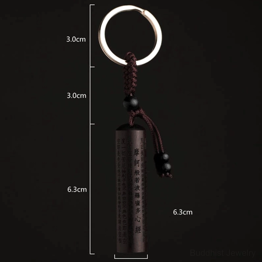 Standard product view of ebony Heart Sutra Buddhist keychain with size markers showing 12.3cm total length on black background
