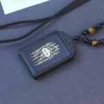 Sterling silver ebony wood lotus pendant necklace with black beaded cord and tiger's eye accents, handmade Buddhist spiritual jewelry