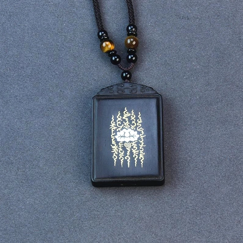 Rectangular ebony wood lotus pendant with sterling silver and sacred patterns, carved top detail of handmade Buddhist pendant