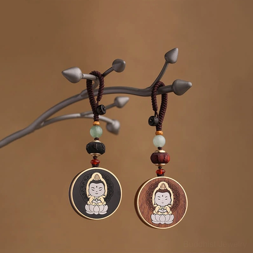 Ebony wood and rosewood Buddhist keychain comparison showing material options