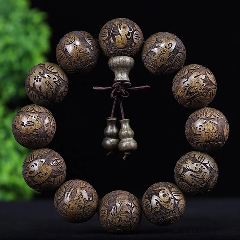 Ebony wood zodiac bracelet featuring all 12 zodiac animals carved on beads for protection and harmony