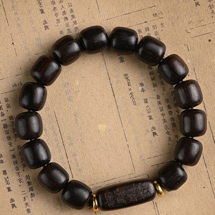 Ebony wood barrel bead bracelet with spiritual meaning for protection, balance, and inner peace